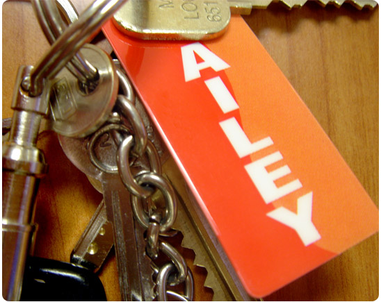 Vertical orange fintess key tag